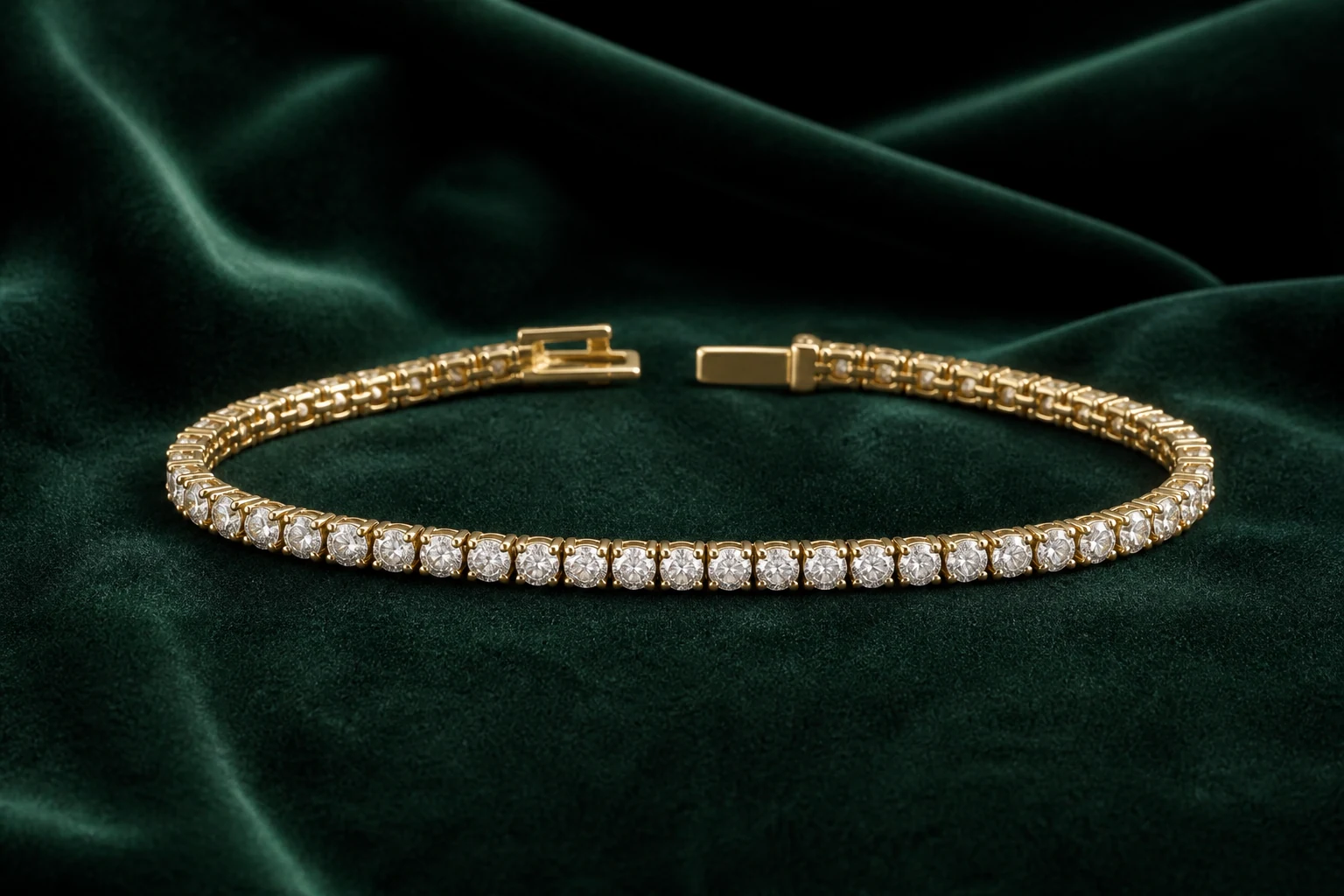 The Rivière Line, a yellow gold diamond tennis bracelet on forest green velvet